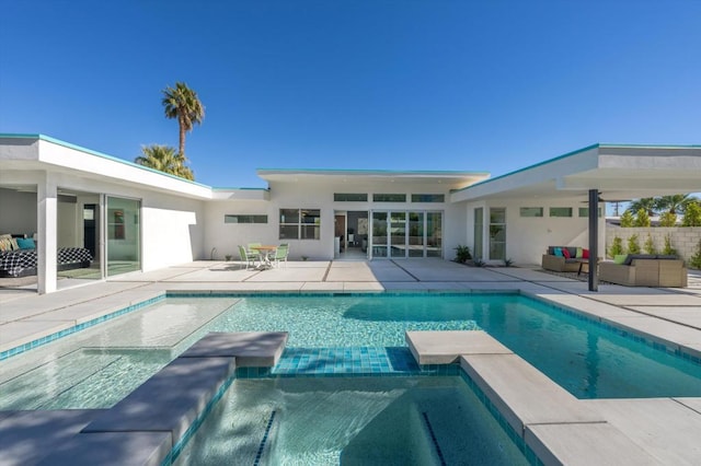 view of swimming pool featuring outdoor lounge area and a patio