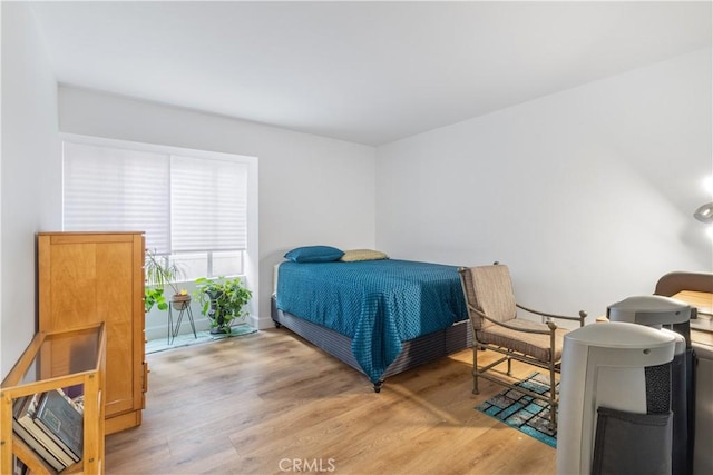 bedroom with hardwood / wood-style flooring