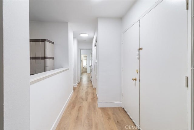 corridor featuring light hardwood / wood-style flooring