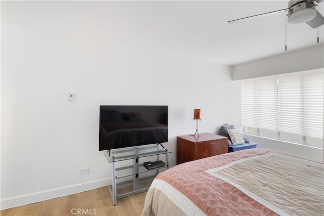 bedroom featuring ceiling fan and light hardwood / wood-style floors