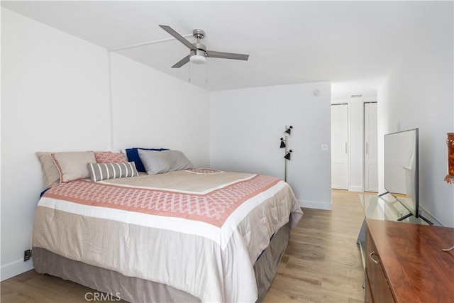 bedroom featuring ceiling fan and light hardwood / wood-style floors