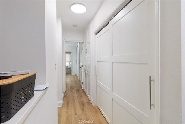 corridor with light wood-type flooring