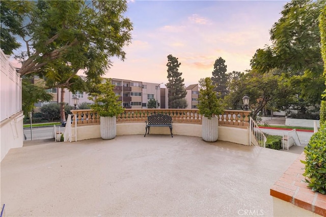 view of patio terrace at dusk