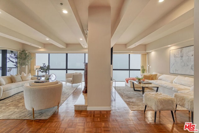 living room featuring beamed ceiling and parquet flooring