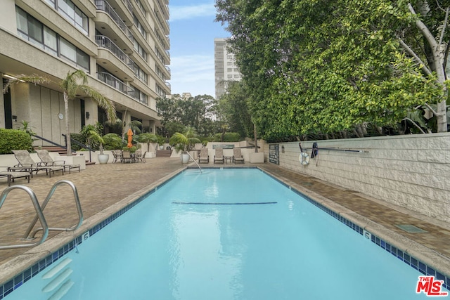 view of pool with a patio area