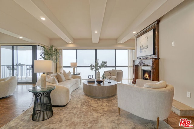 living room with beam ceiling, parquet flooring, and a wealth of natural light