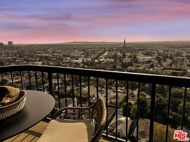 view of balcony at dusk