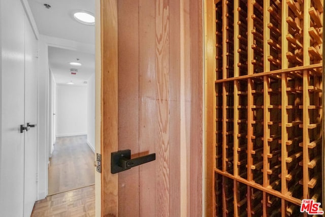 wine cellar with parquet flooring