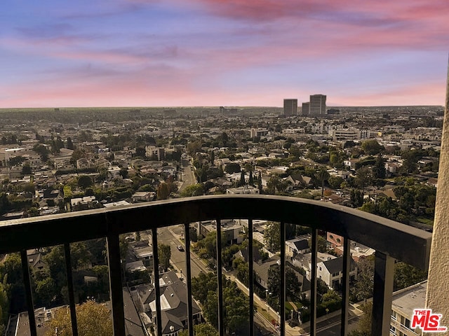 view of balcony at dusk