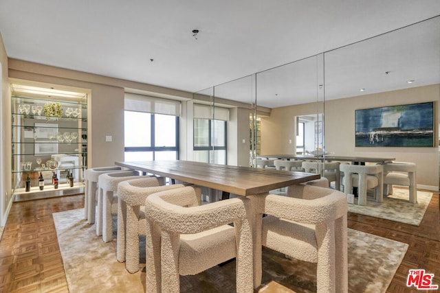 dining room featuring parquet flooring