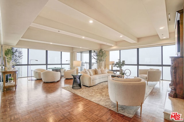 living room featuring beam ceiling and parquet floors