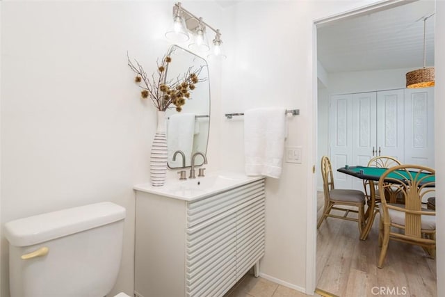 1809 W Bay Ave, Newport Beach, CA 92663 - bathroom featuring vanity, toilet, and hardwood / wood-style floors