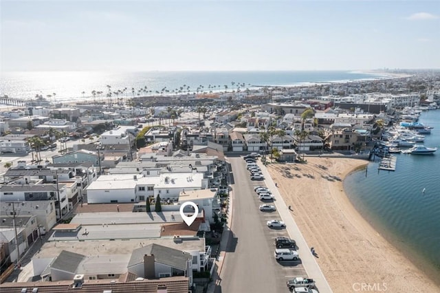 birds eye view of property featuring a water view and a view of the beach