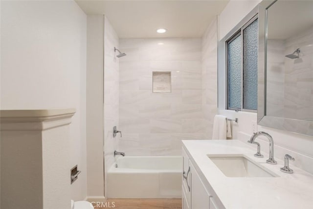 1809 W Bay Ave, Newport Beach, CA 92663 - bathroom with wood-type flooring, tiled shower / bath, and vanity