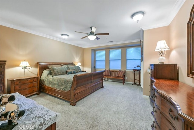 carpeted bedroom featuring ceiling fan and ornamental molding