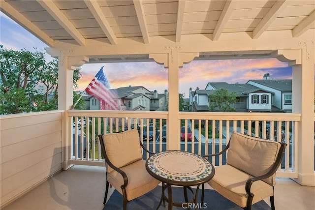 view of balcony at dusk