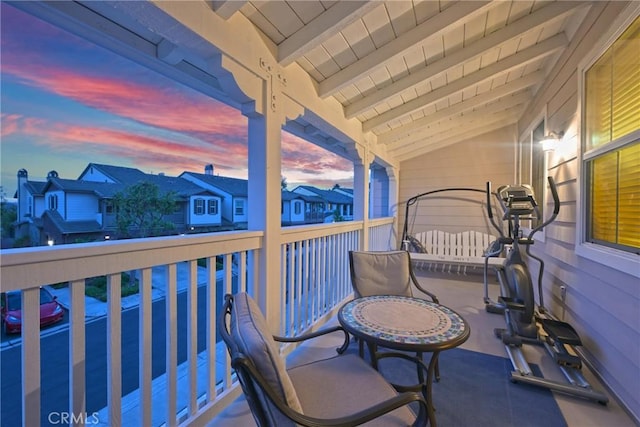 view of balcony at dusk