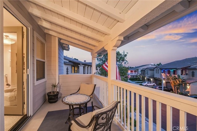 view of balcony at dusk