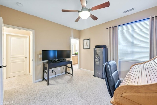 office featuring ceiling fan and light colored carpet