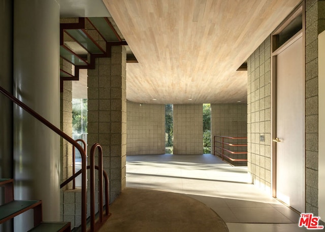 interior space featuring a wealth of natural light and tile walls