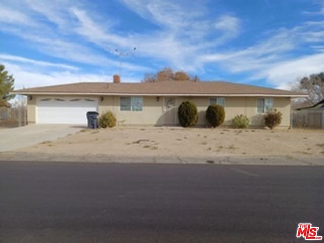 single story home with a garage