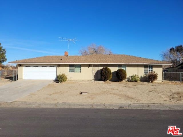 single story home featuring a garage