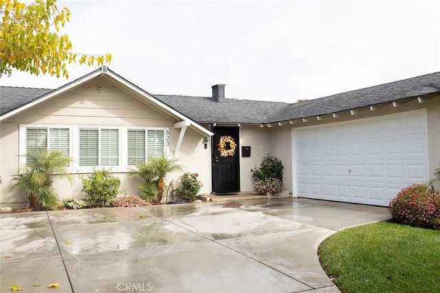 ranch-style house featuring a garage