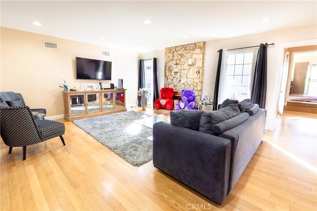 living room with light hardwood / wood-style flooring