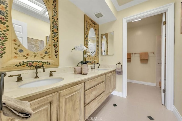 bathroom with tile patterned floors and vanity