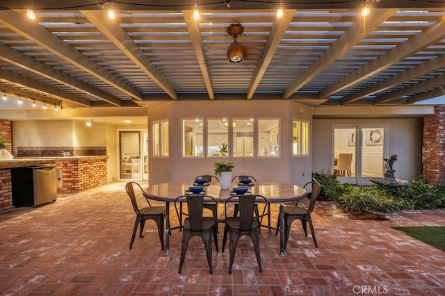 view of patio / terrace with a pergola and exterior kitchen