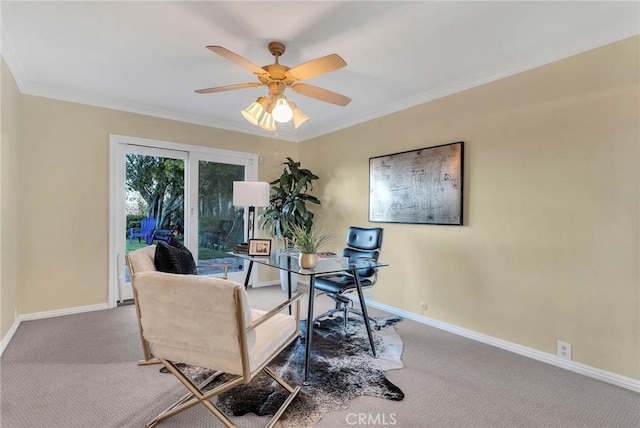 office area with ceiling fan, carpet, and ornamental molding