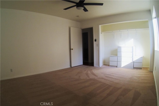 unfurnished bedroom with ceiling fan, a closet, and light colored carpet