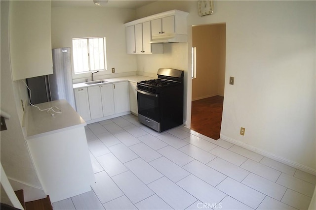 kitchen with white cabinets, sink, black range with gas cooktop, and vaulted ceiling