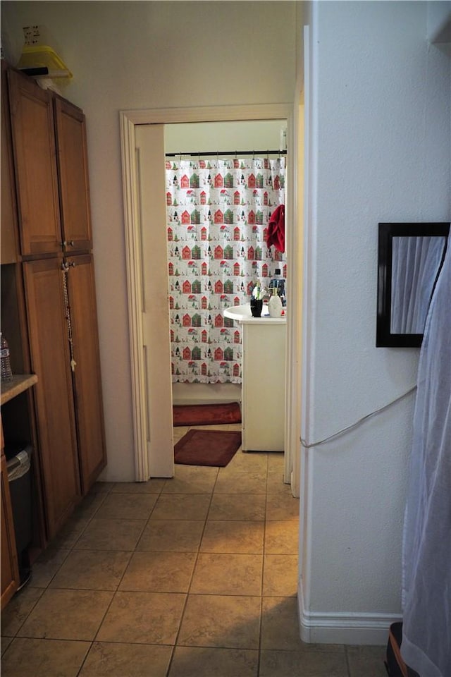 bathroom with tile patterned floors