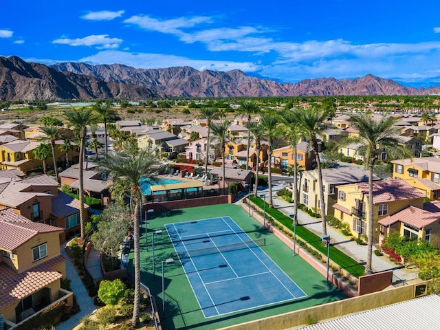 birds eye view of property with a mountain view