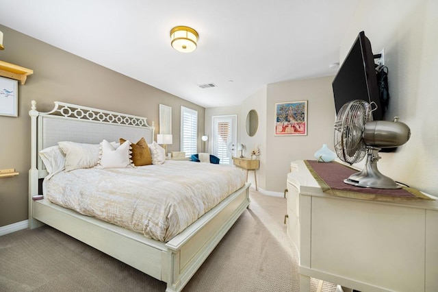 bedroom with light colored carpet