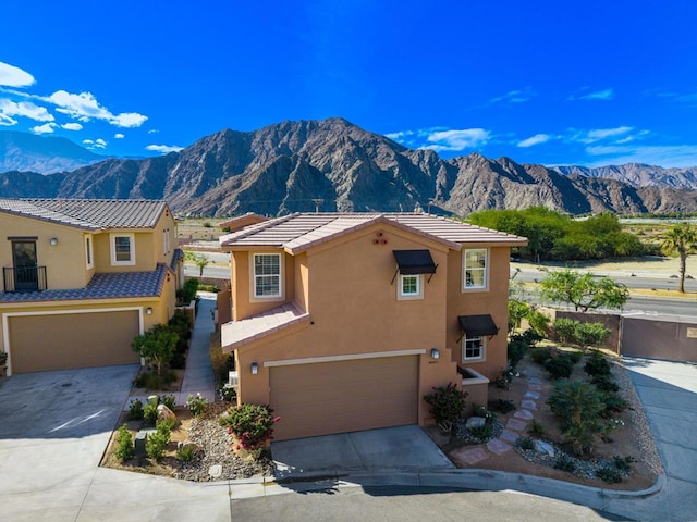 view of front of house featuring a mountain view and a garage