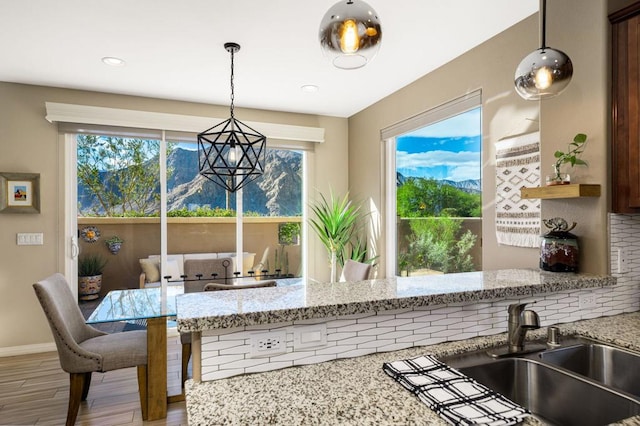 dining room featuring hardwood / wood-style floors and sink