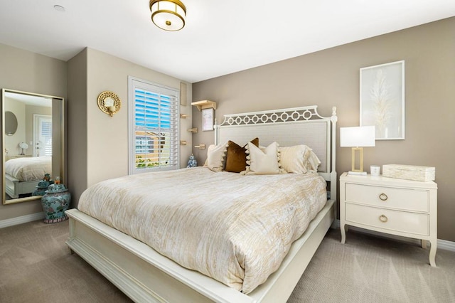 bedroom featuring dark colored carpet