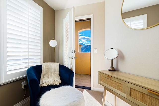 sitting room featuring tile patterned flooring