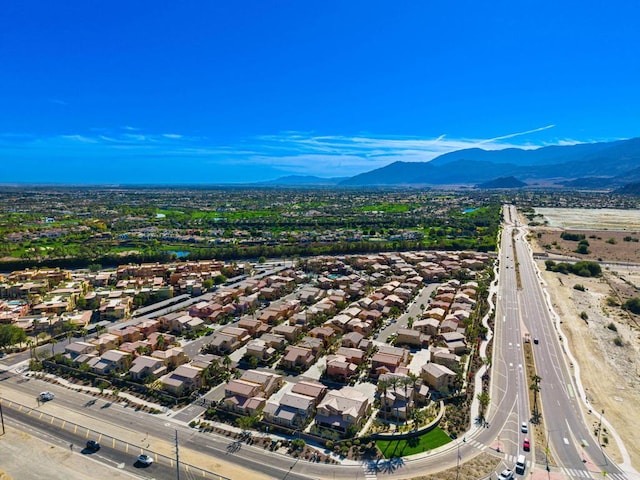 birds eye view of property featuring a mountain view