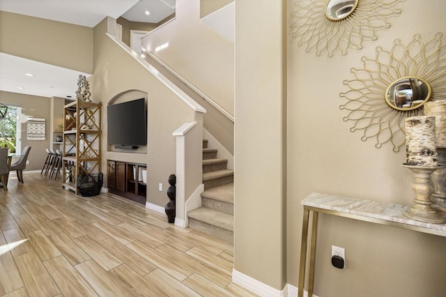 stairway with wood-type flooring