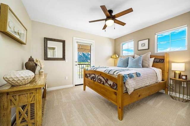 bedroom with ceiling fan, light carpet, and access to outside