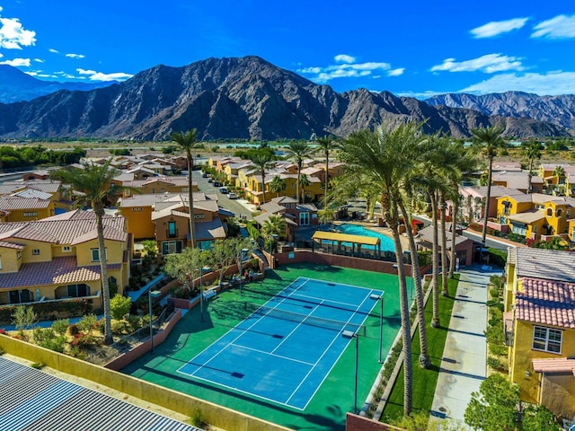 view of tennis court with a mountain view