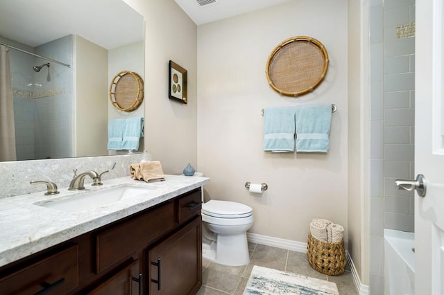 full bathroom with toilet, vanity, tile patterned floors, and tiled shower / bath combo