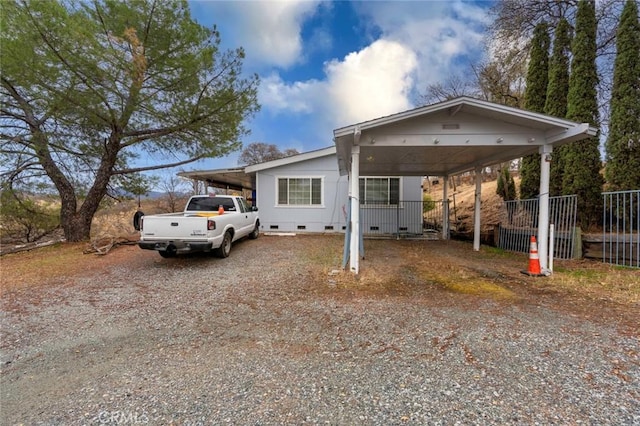 view of front of house featuring a carport