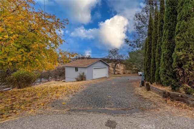 view of home's exterior with an outbuilding and a garage