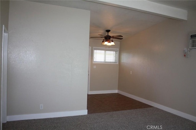 unfurnished room with ceiling fan, carpet flooring, baseboards, an AC wall unit, and beam ceiling