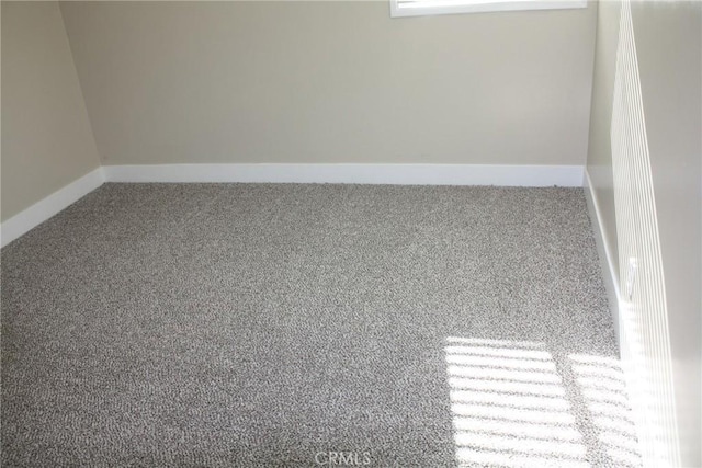 spare room with carpet floors and baseboards