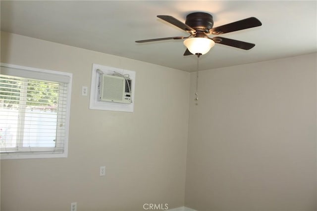 unfurnished room featuring ceiling fan and an AC wall unit